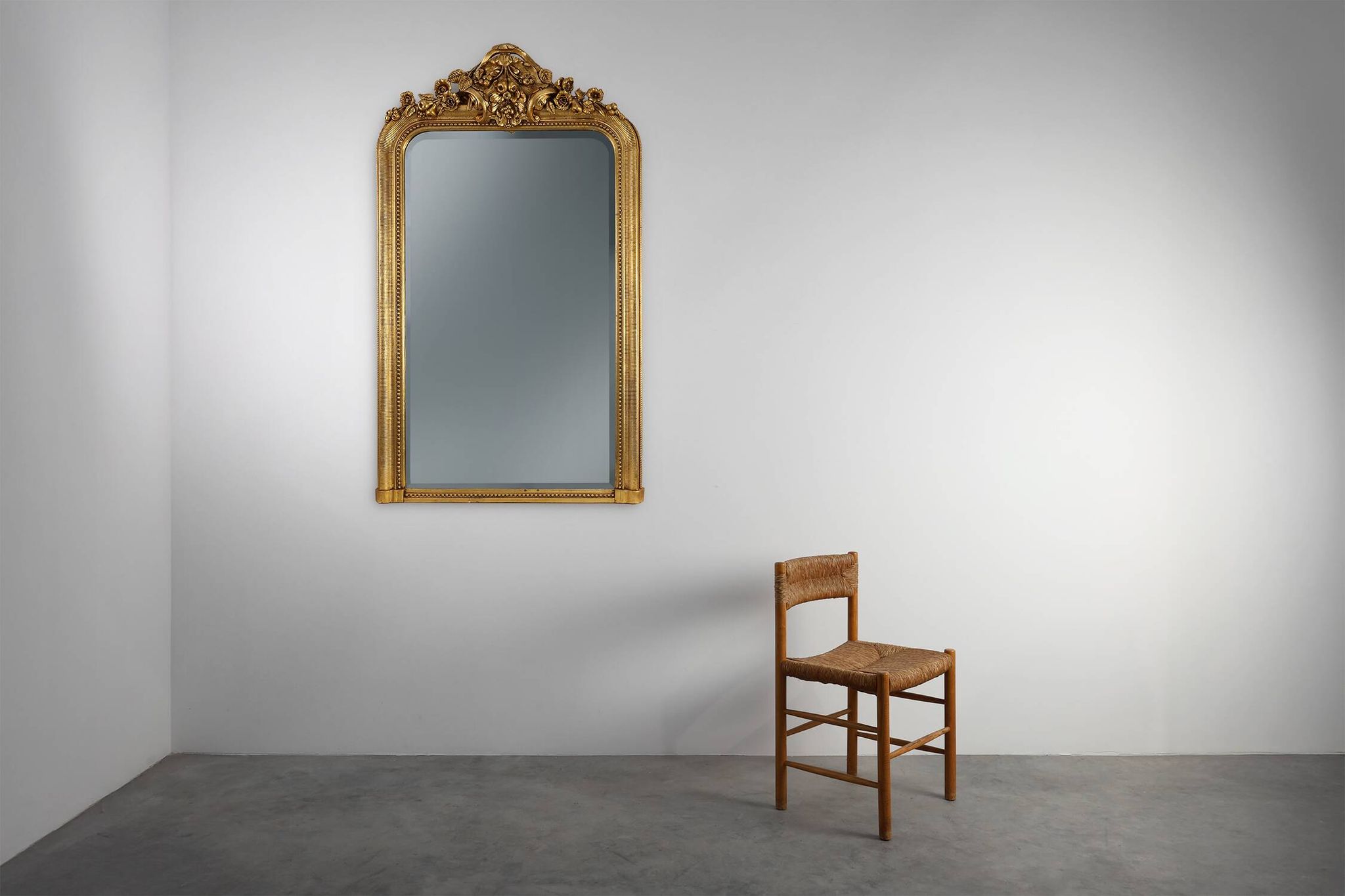 Baroque mantel mirror in carved wood and gilded plaster, France circa 1850.