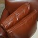 Edwardian leather club canapé circa 1910 with feather cushions.