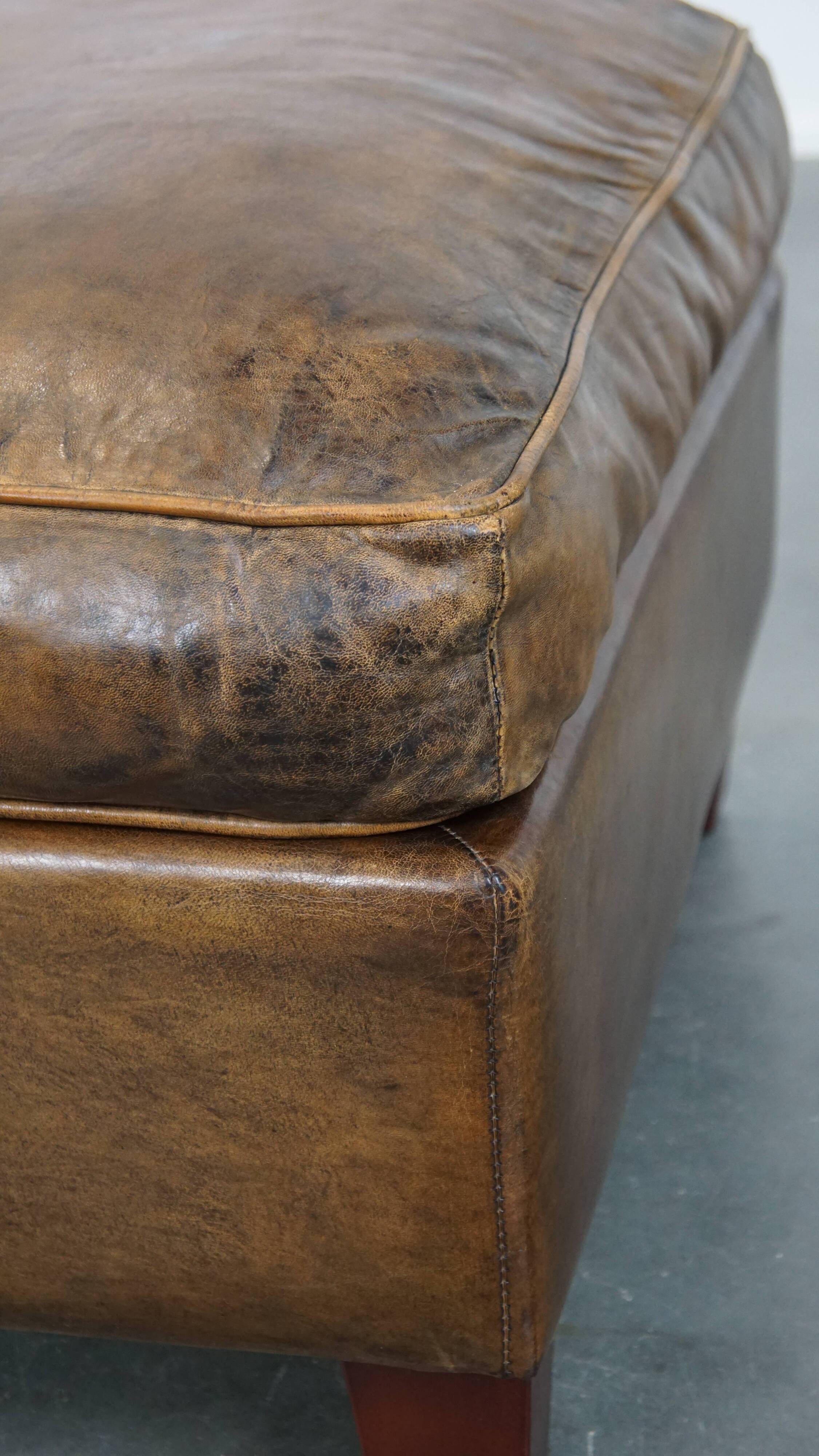 Sheepskin wing chair + XXL patinated footrest