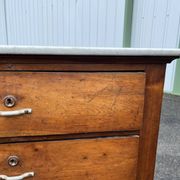 Antique 19th-century wooden chest of drawers with a marble top