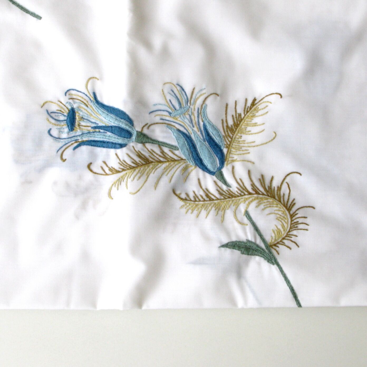 Antique rectangular hand-embroidered tablecloth decorated with thistle and 12 towels