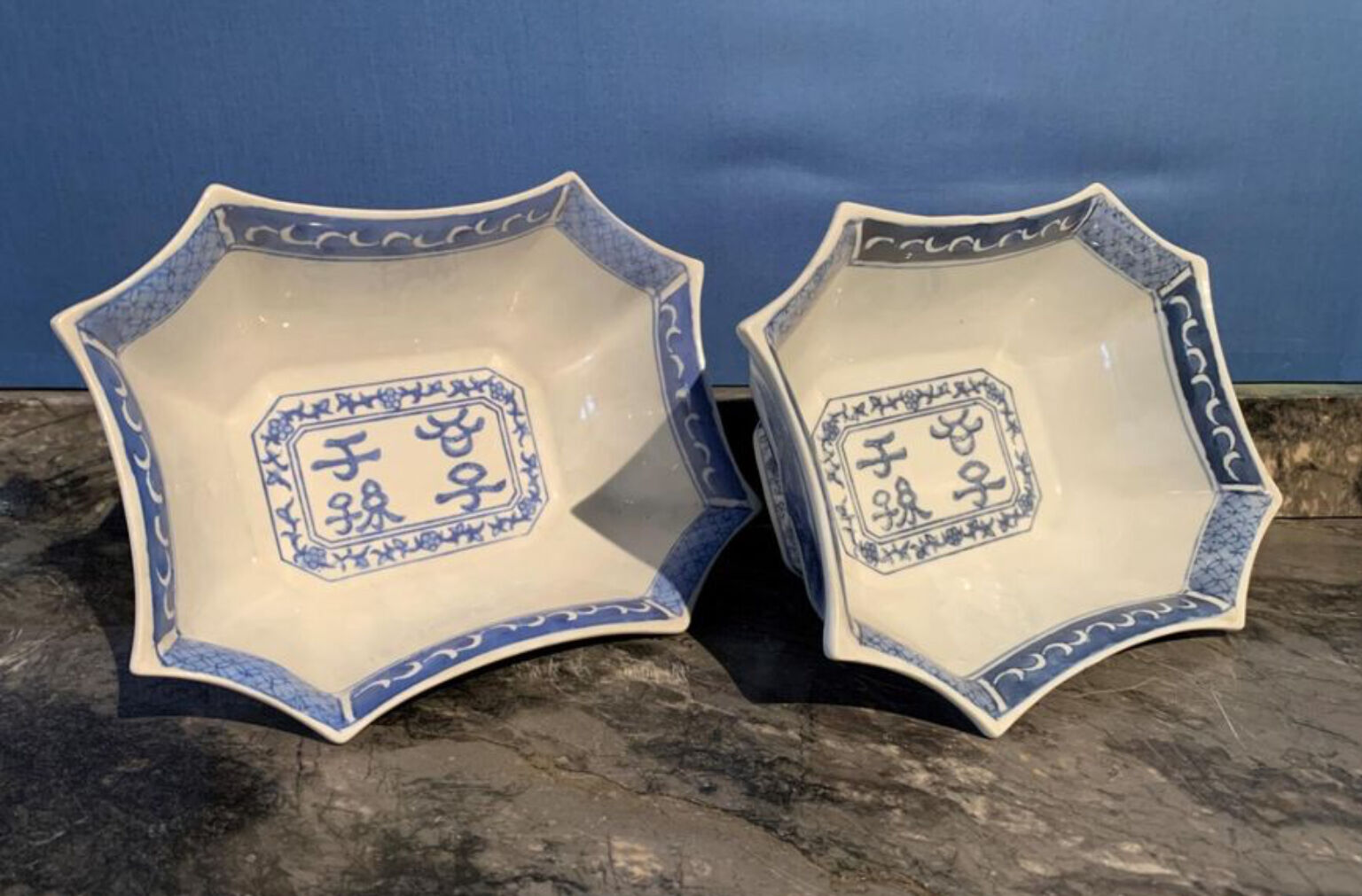 Suite of 2 porcelain jattes decorated with blue white decoration of landscapes and ideograms in reserve