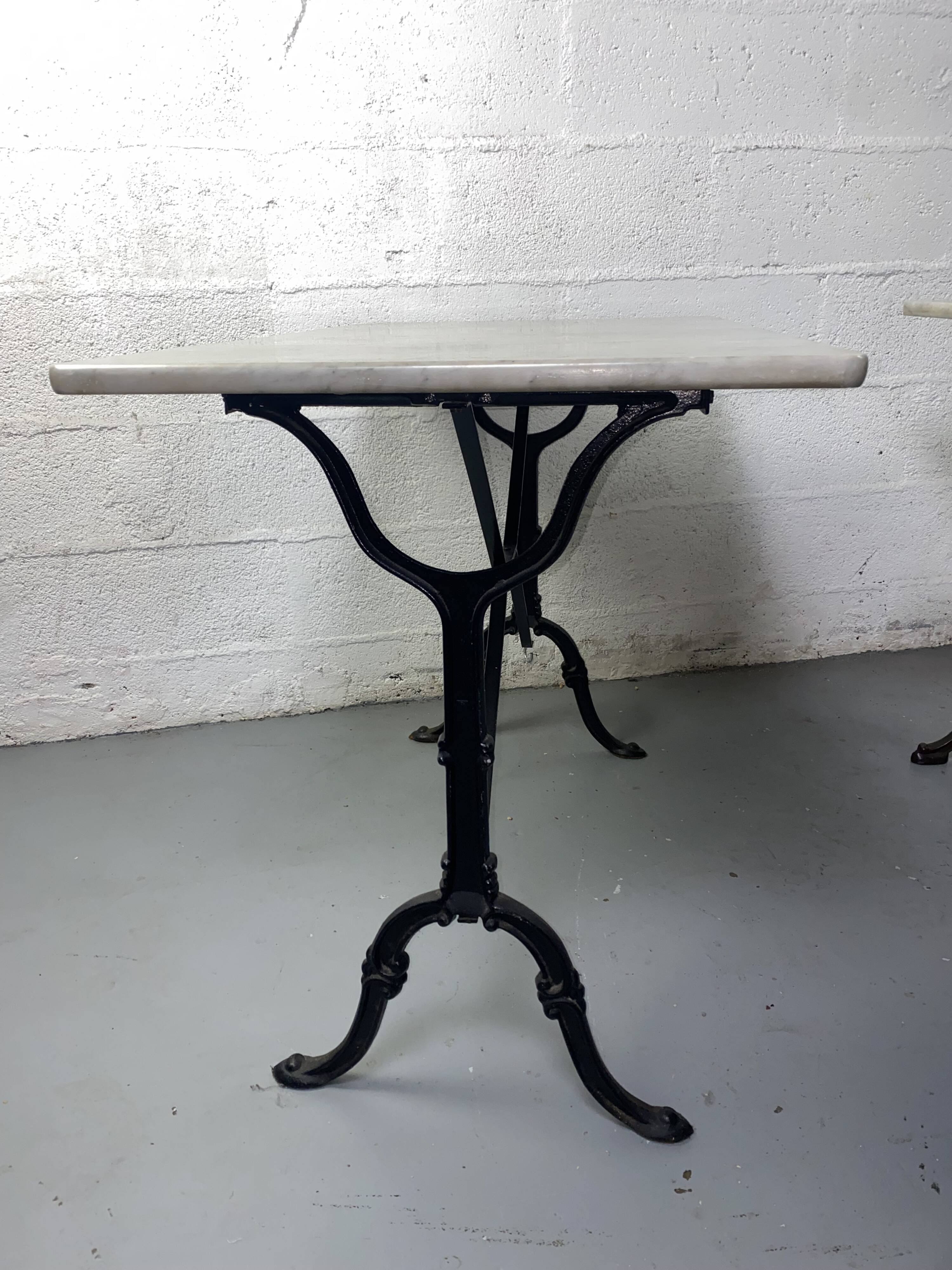 Set of two bistro tables in marble and wrought iron