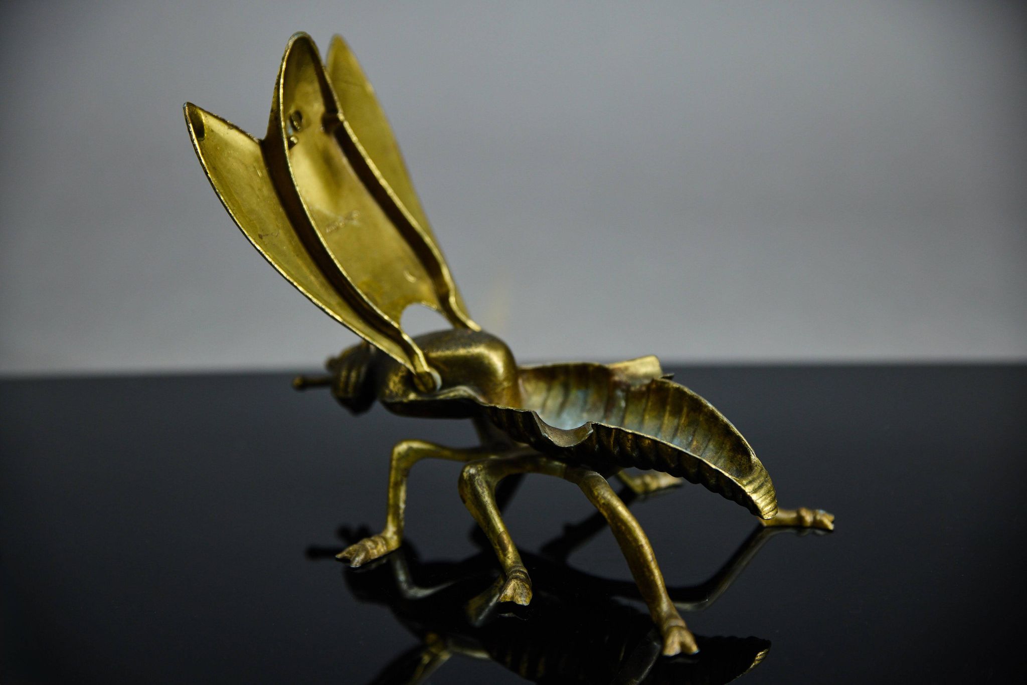 Sculptural ashtray in the shape of a giant fly in brass, Italy, circa 1950.