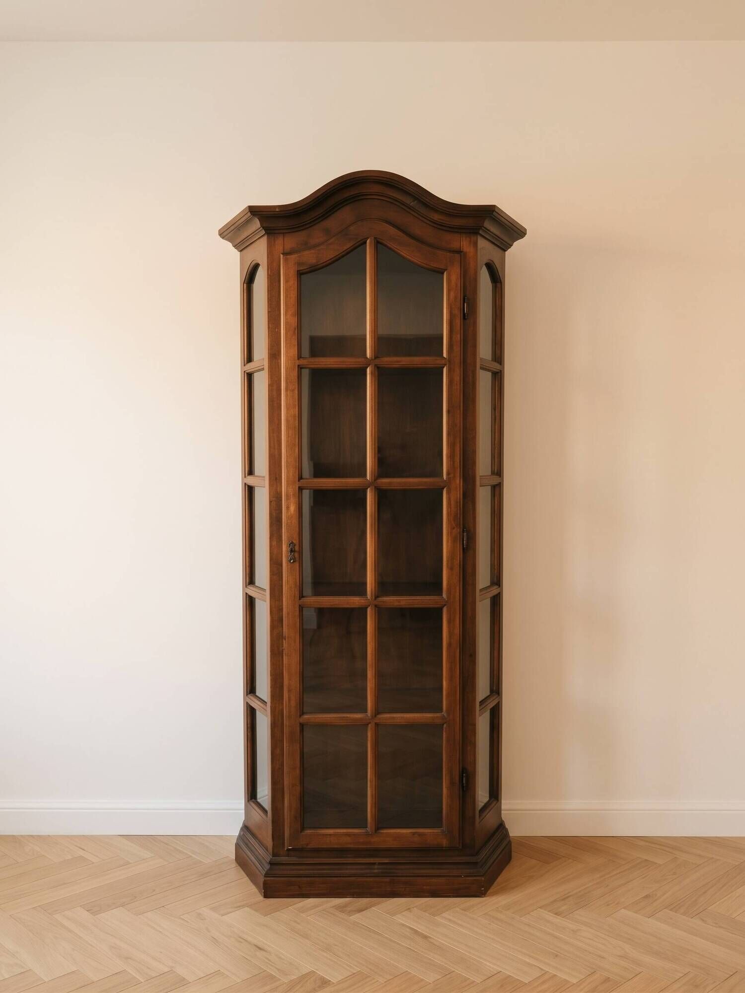 Antique display cabinet in rustic style made of solid wood.
