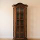 Antique display cabinet in rustic style made of solid wood.