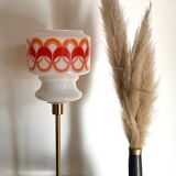Table lamp with a vintage globe with orange patterns from the 70s and a golden base