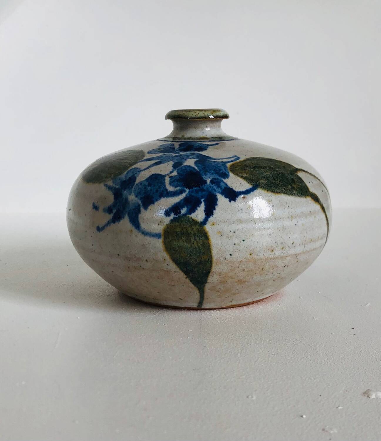Ceramic bud vase with floral decoration