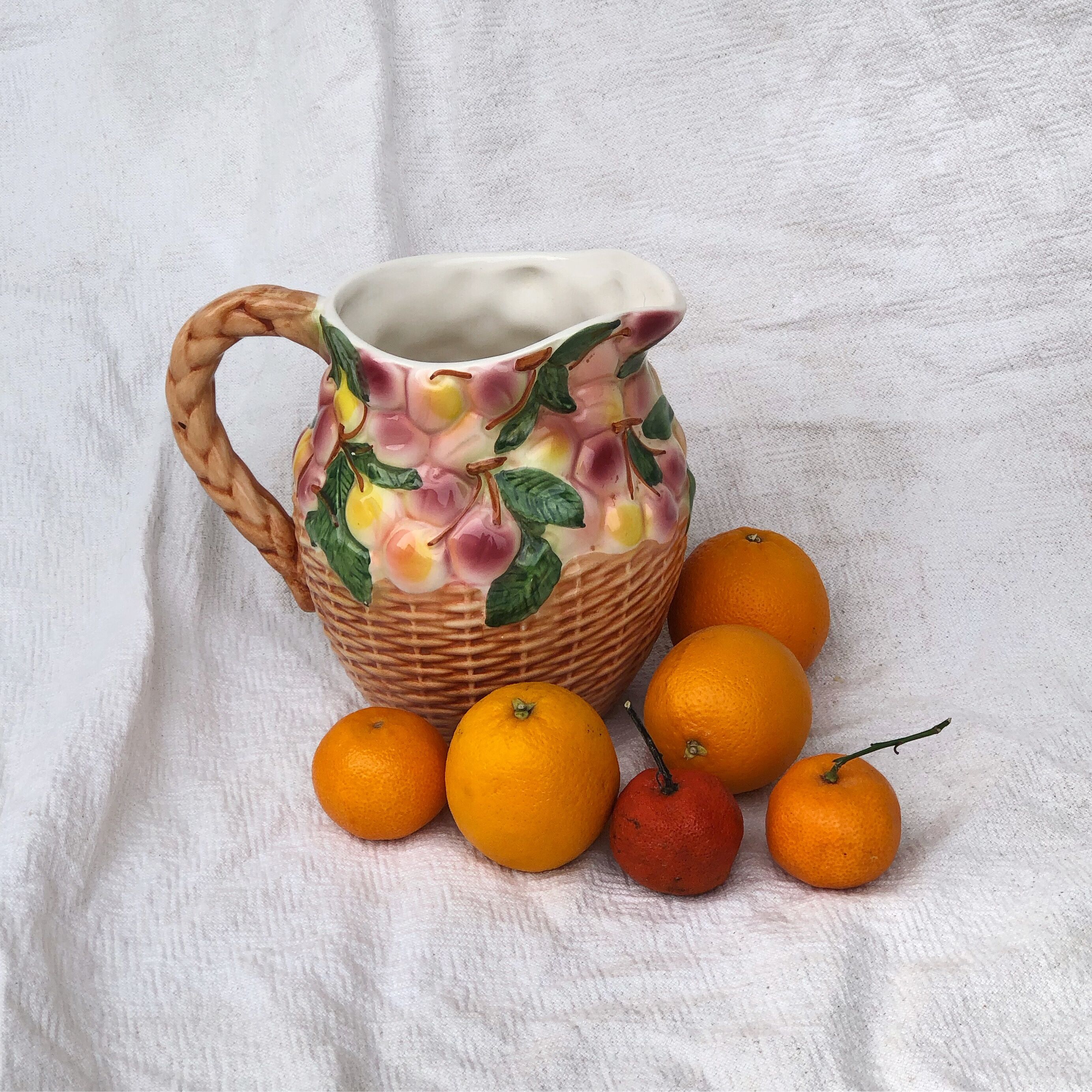 Vintage pitcher in cherry patterned dabbling