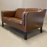 Scandinavian design 2-seater leather sofa.