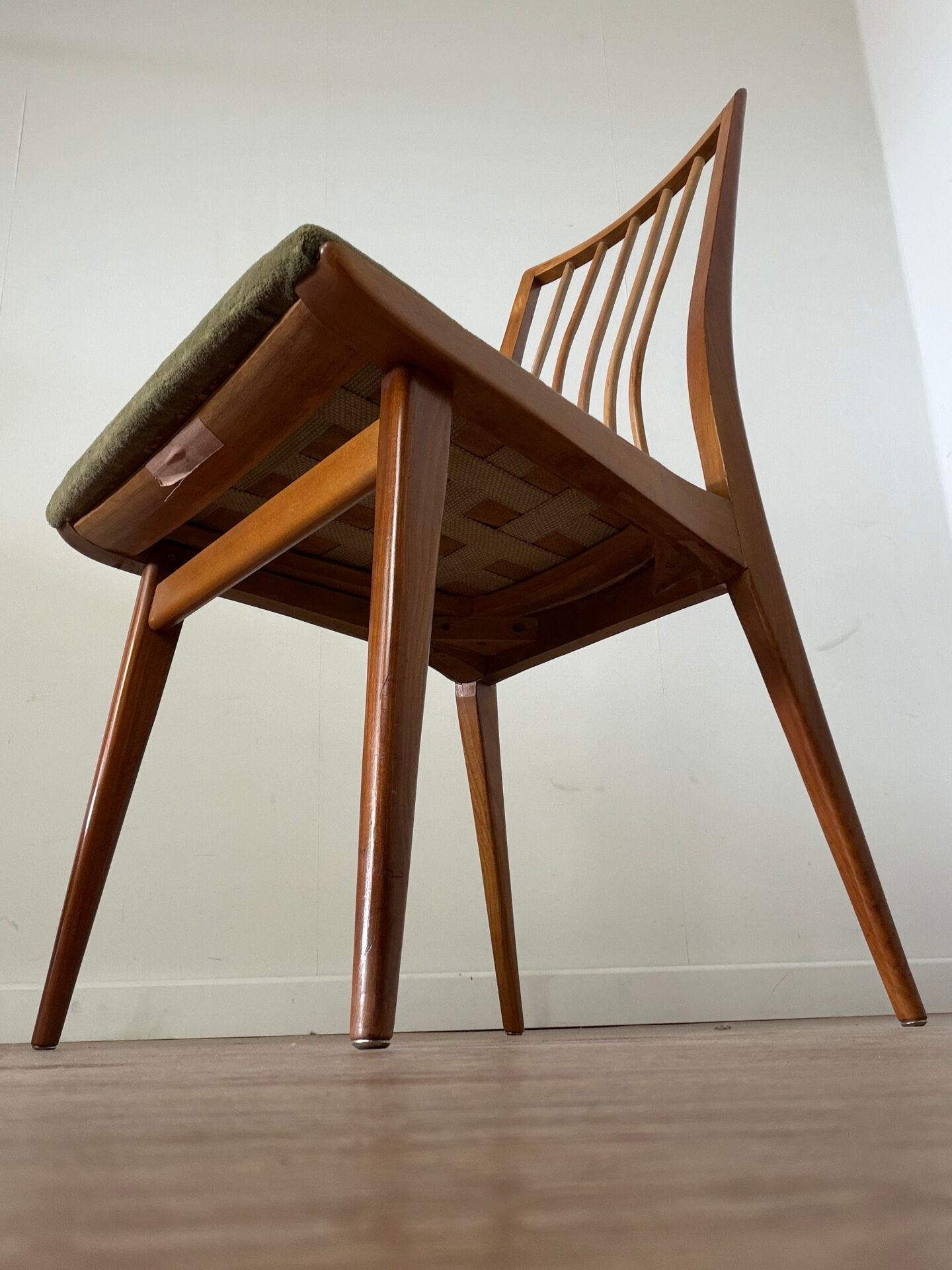 Scandinavian chairs with green velvet upholstery.