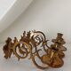 Pair of antique wall-mounted brass candle holders
