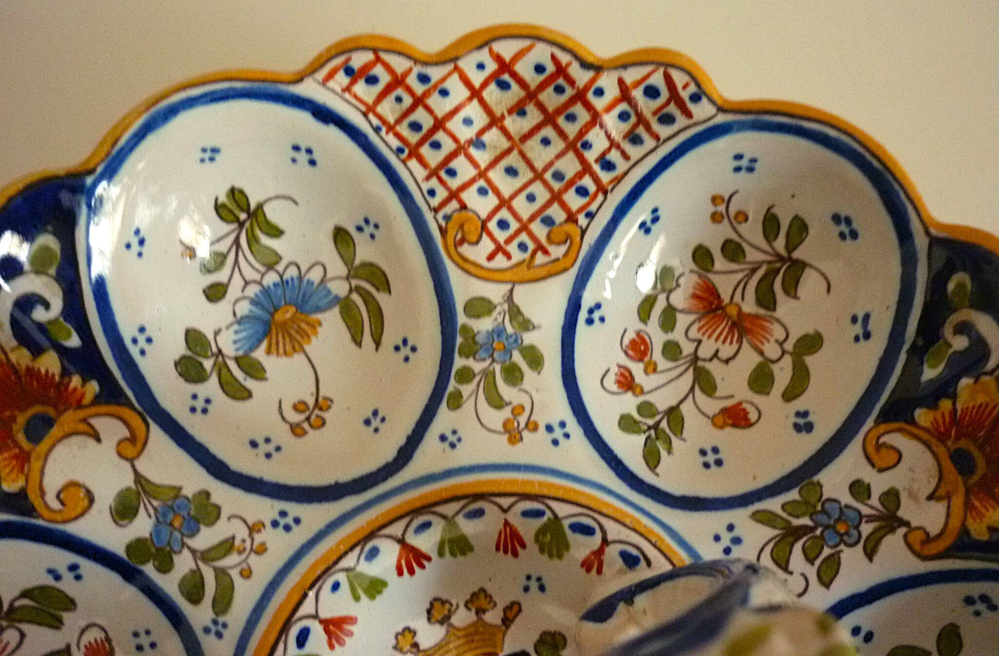 Dish, egg server in hand-painted earthenware, signed Geo Martel