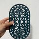 Duo of oval red and green cast iron trivets 60s 70s