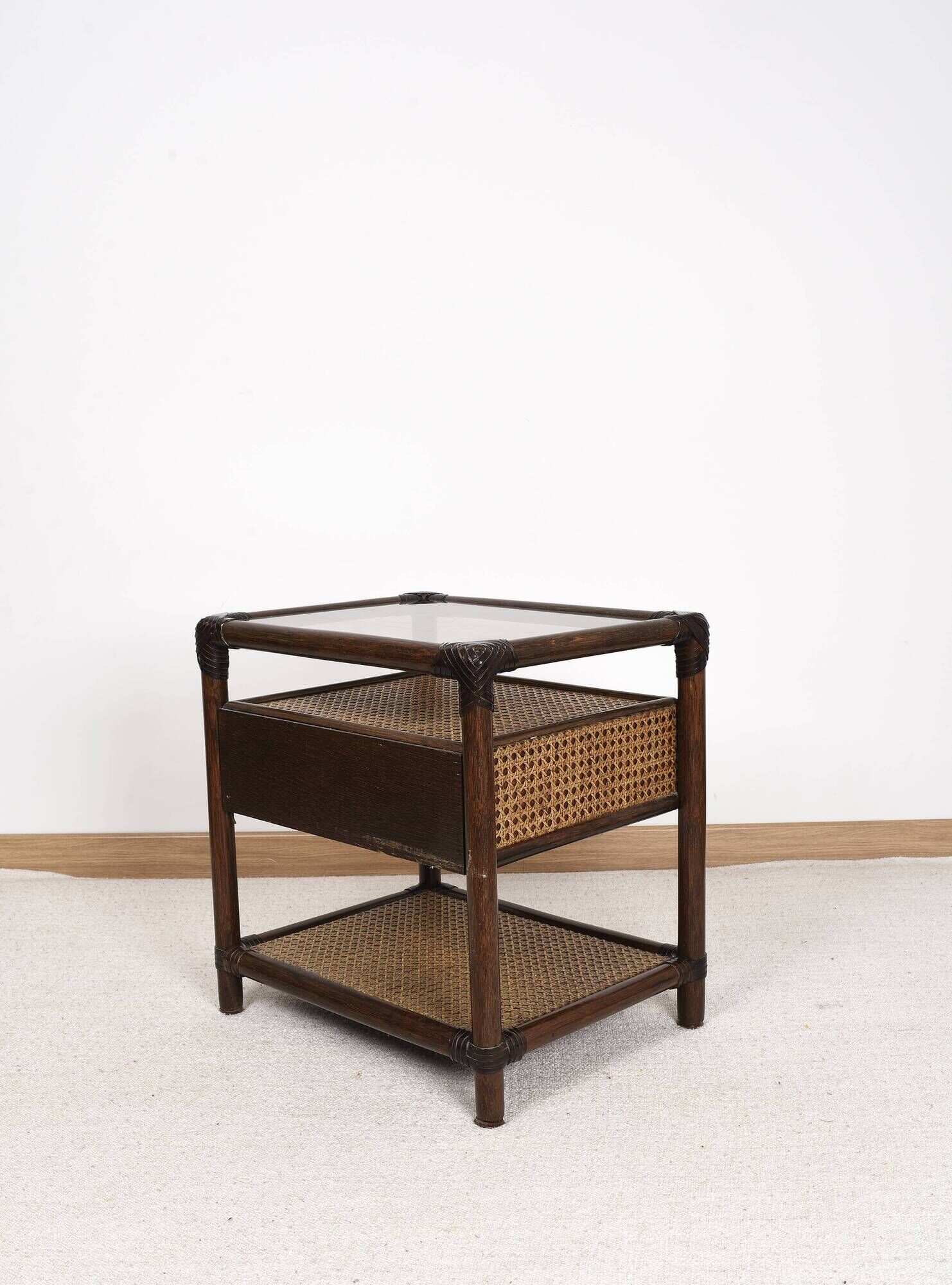 Rattan and cane bedside table, smoked glass top