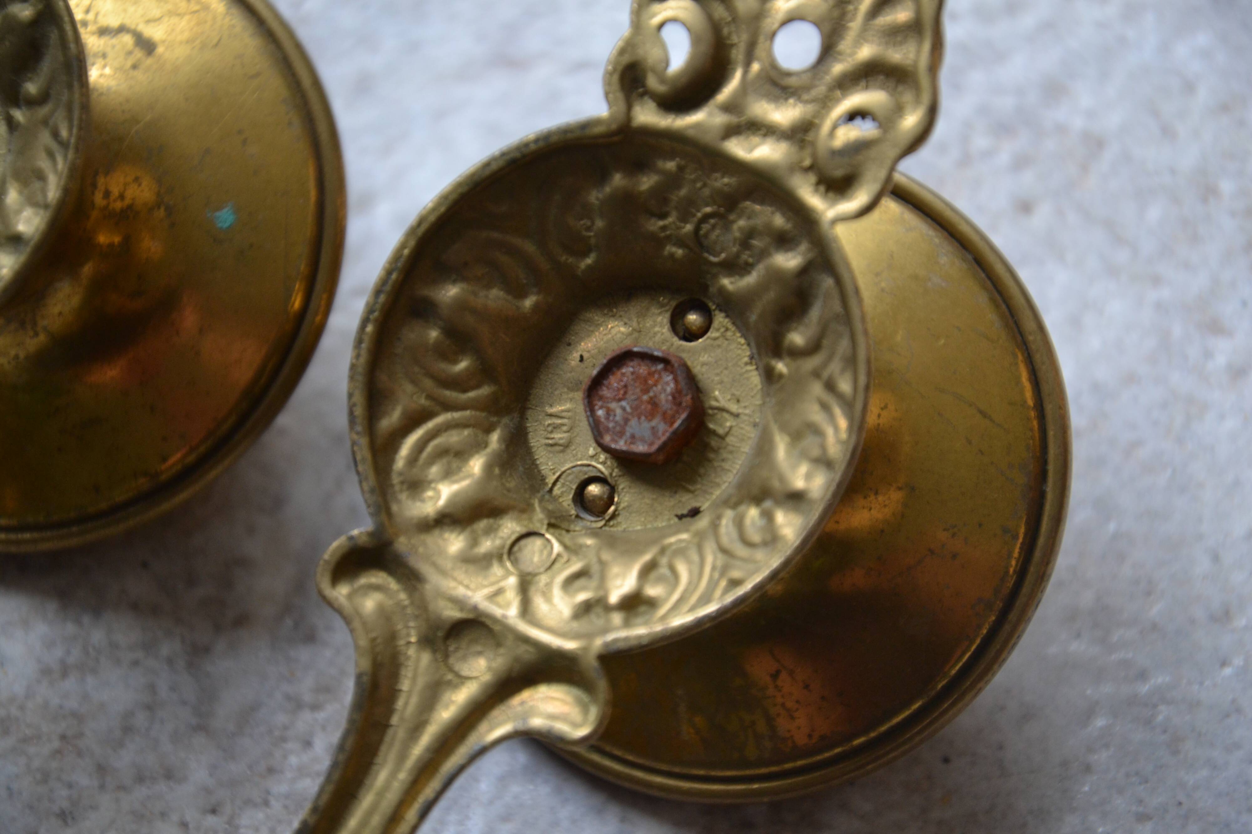 Three coat hooks with brass hook