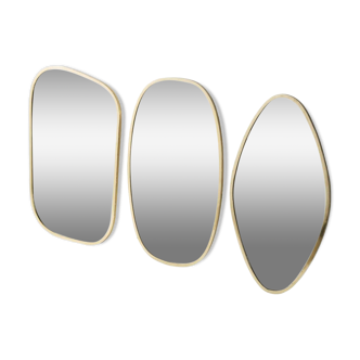 Set of 3 different shaped mirrors in gilded brass