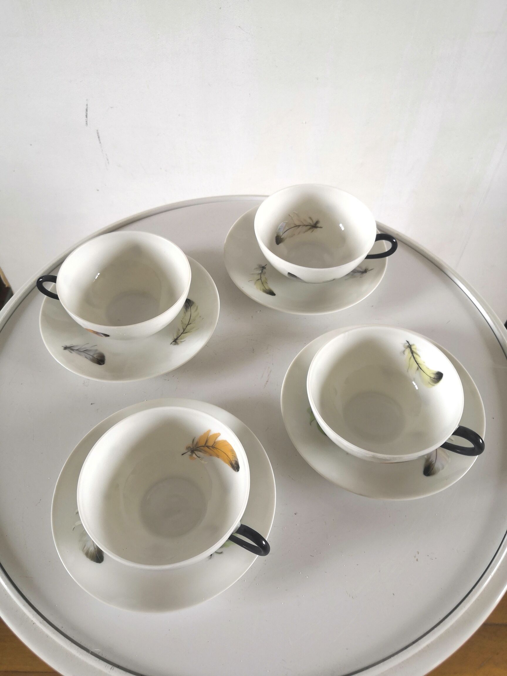 4 cups and cups in fine Limoges porcelain signed LC 60s