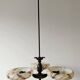 Art Deco bronze three-arm chandelier with marbled glass shades.