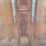 Louis XV Nantaise wardrobe carved with grape clusters, cherry gendarme hat at the end of the 19th century.