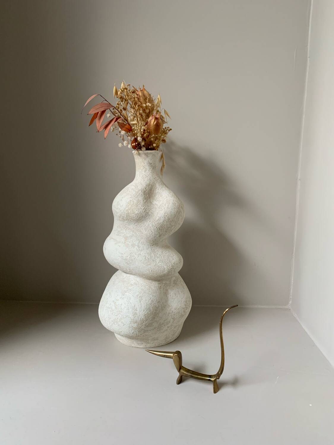 White stoneware vase in an organic shape