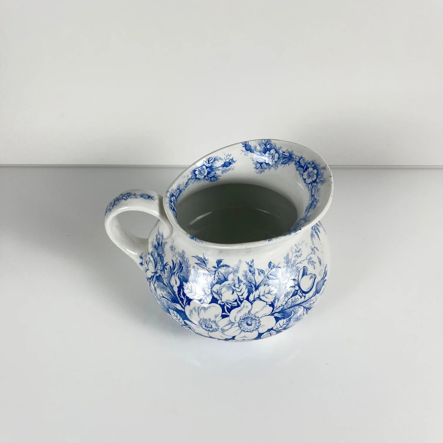 Chubby pitcher, old toilet jug KG Lunéville, blue flower pattern, late 19th to early 20th century.