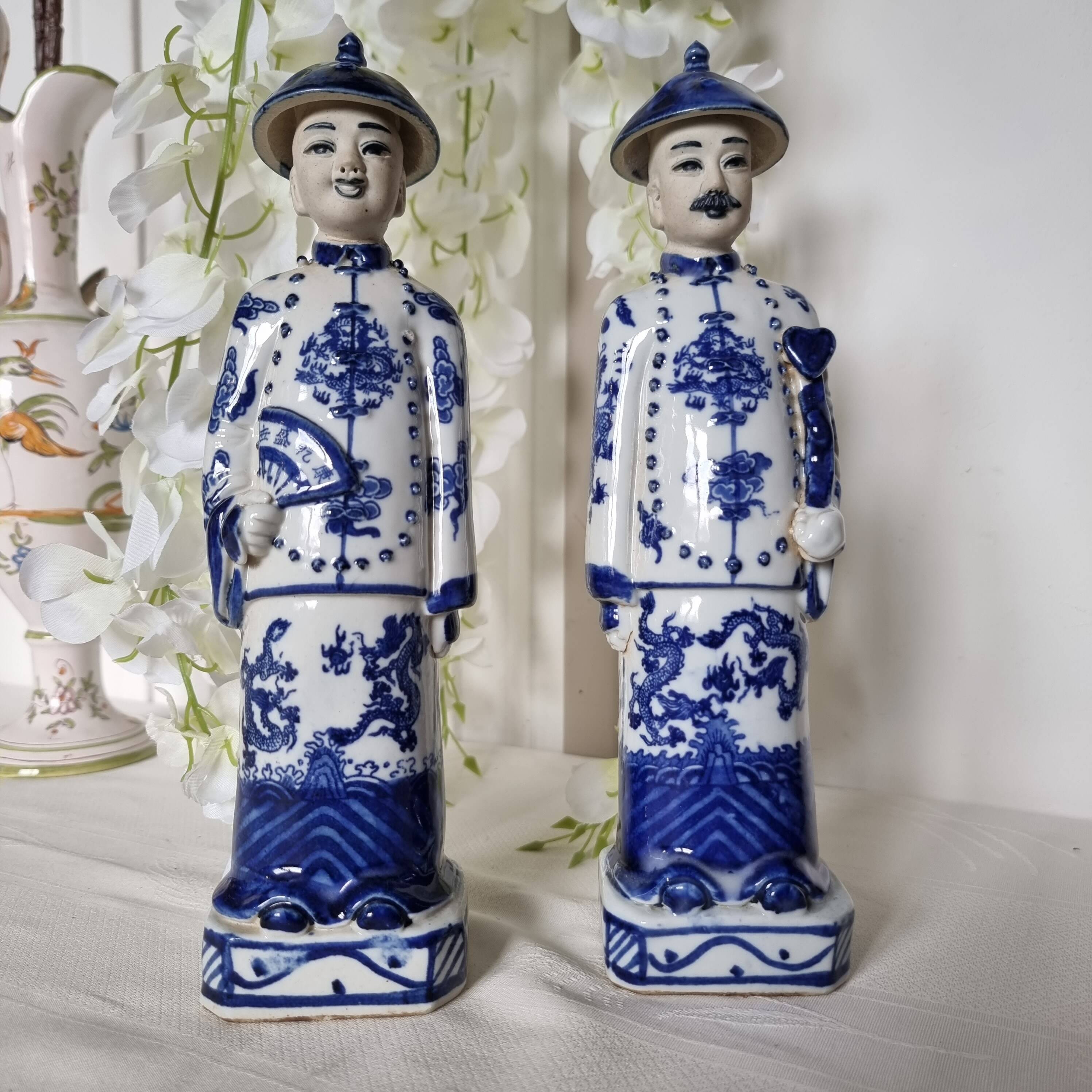 Pair of vintage Chinese blue and white porcelain figurines depicting