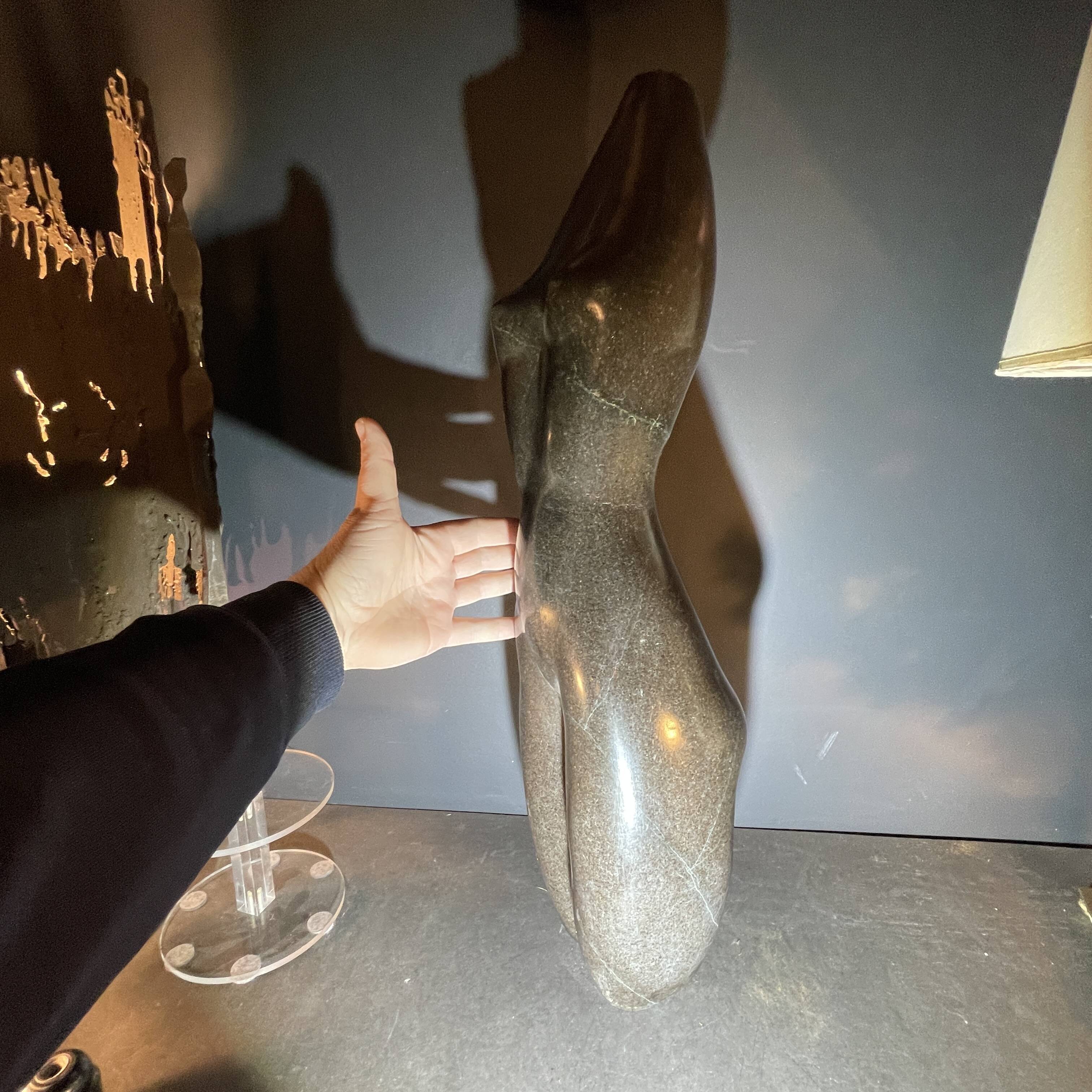 Abstract sculpture "naked woman" in stone (black marble), signed work, 20th century