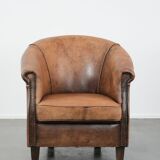 Vintage sheepskin club armchair with character and a beautiful patina