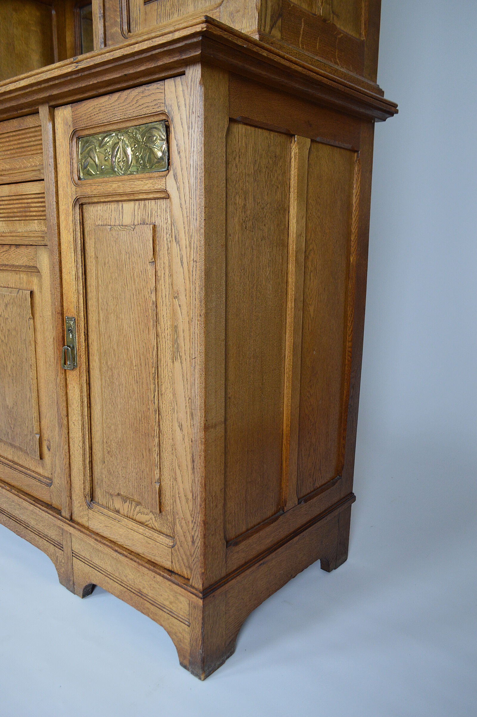 Art Nouveau oak buffet and dinanderie panels, circa 1910