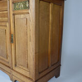 Art Nouveau oak buffet and dinanderie panels, circa 1910