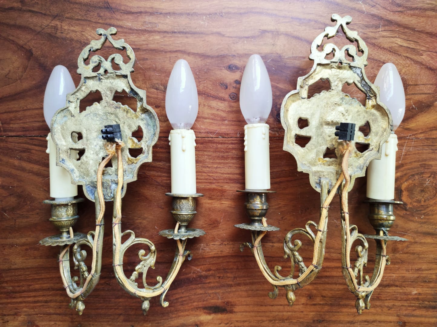 Pair of gilded bronze sconces decorated with Louis XIV style mascarons