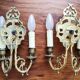 Pair of gilded bronze sconces decorated with Louis XIV style mascarons