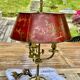 Bronze-gilt bouillotte lamp XIXth century with a tin shade featuring Japonese decoration.