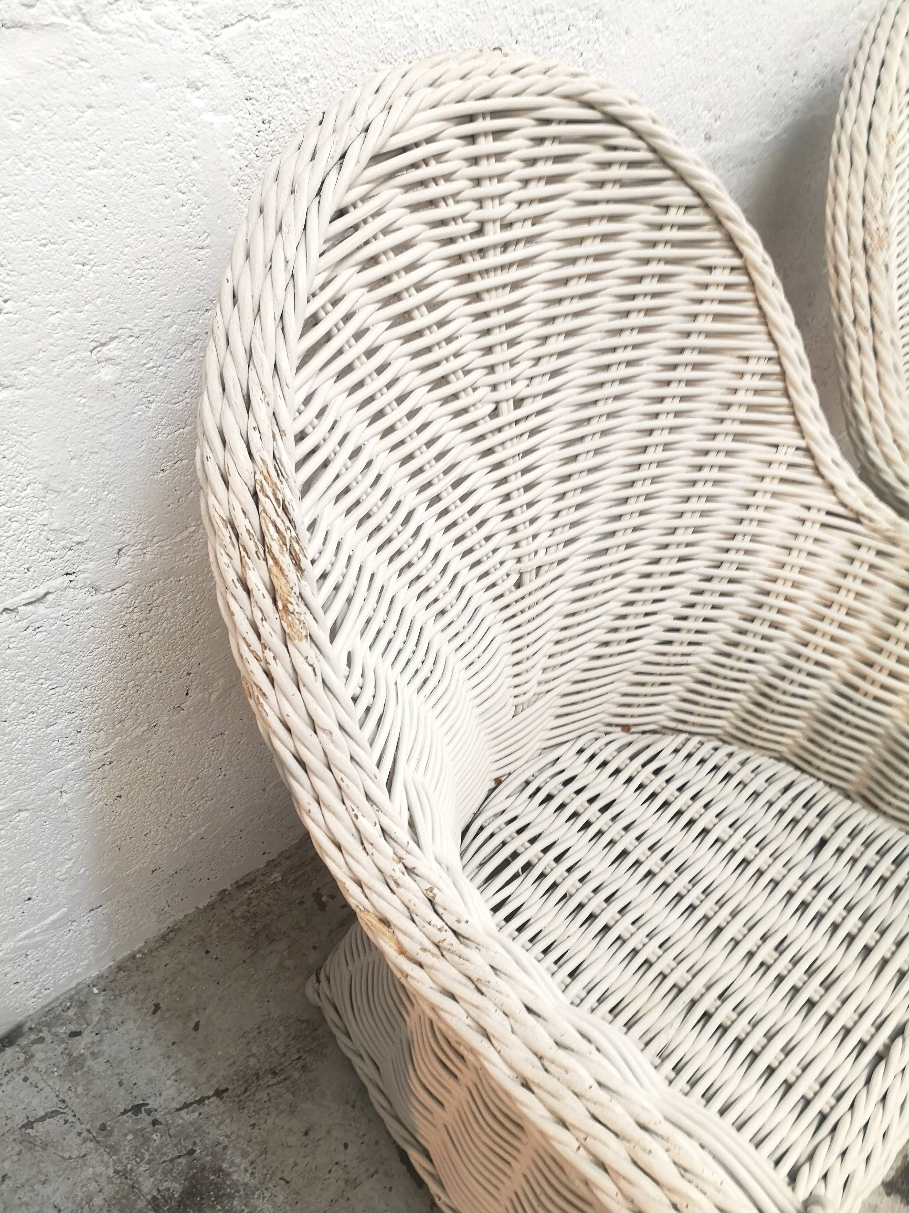 Pair of white rattan armchairs