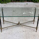 Regency style glass coffee table with crossed legs
