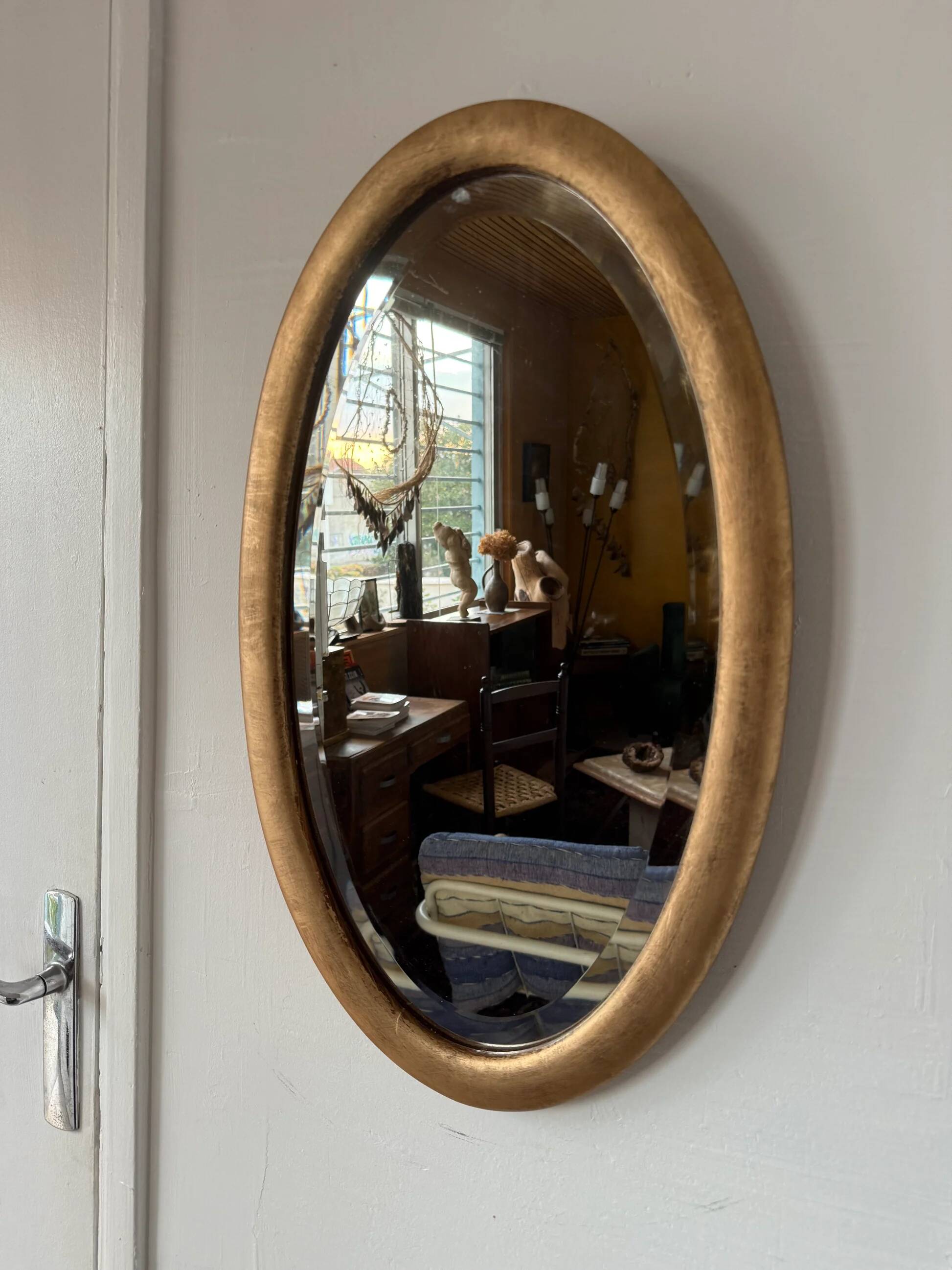 Miroir doré ovale ancien glace biseautée