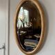 Miroir doré ovale ancien glace biseautée