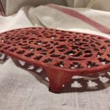 Vintage oval dark coral pink cast iron trivet