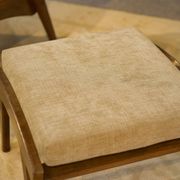 Scandinavian armchair and two 1960s ottomans.