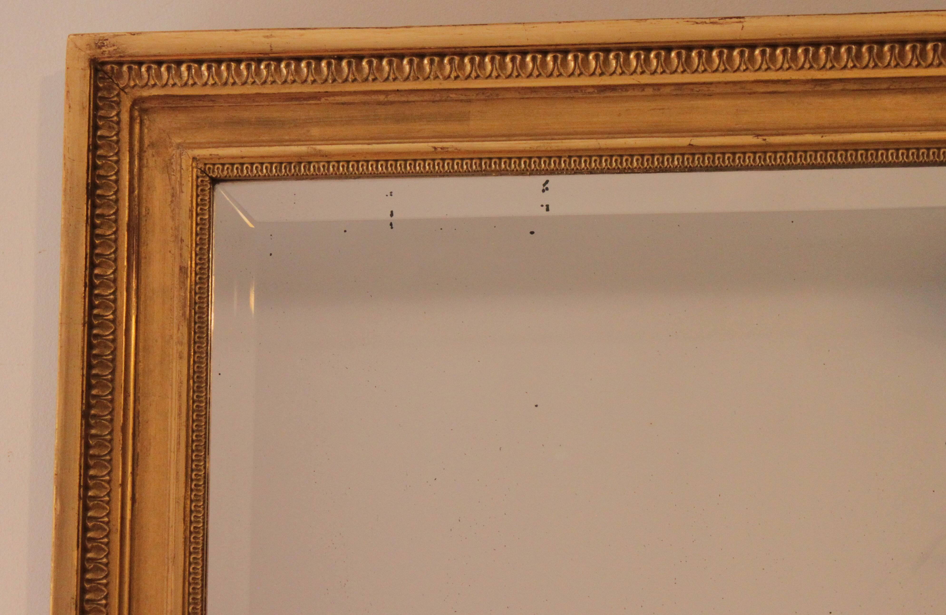 Large bevelled gold mirror