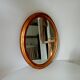 Antique oval mirror in gilded solid wood