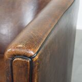 Sheep leather club chair finished with black piping