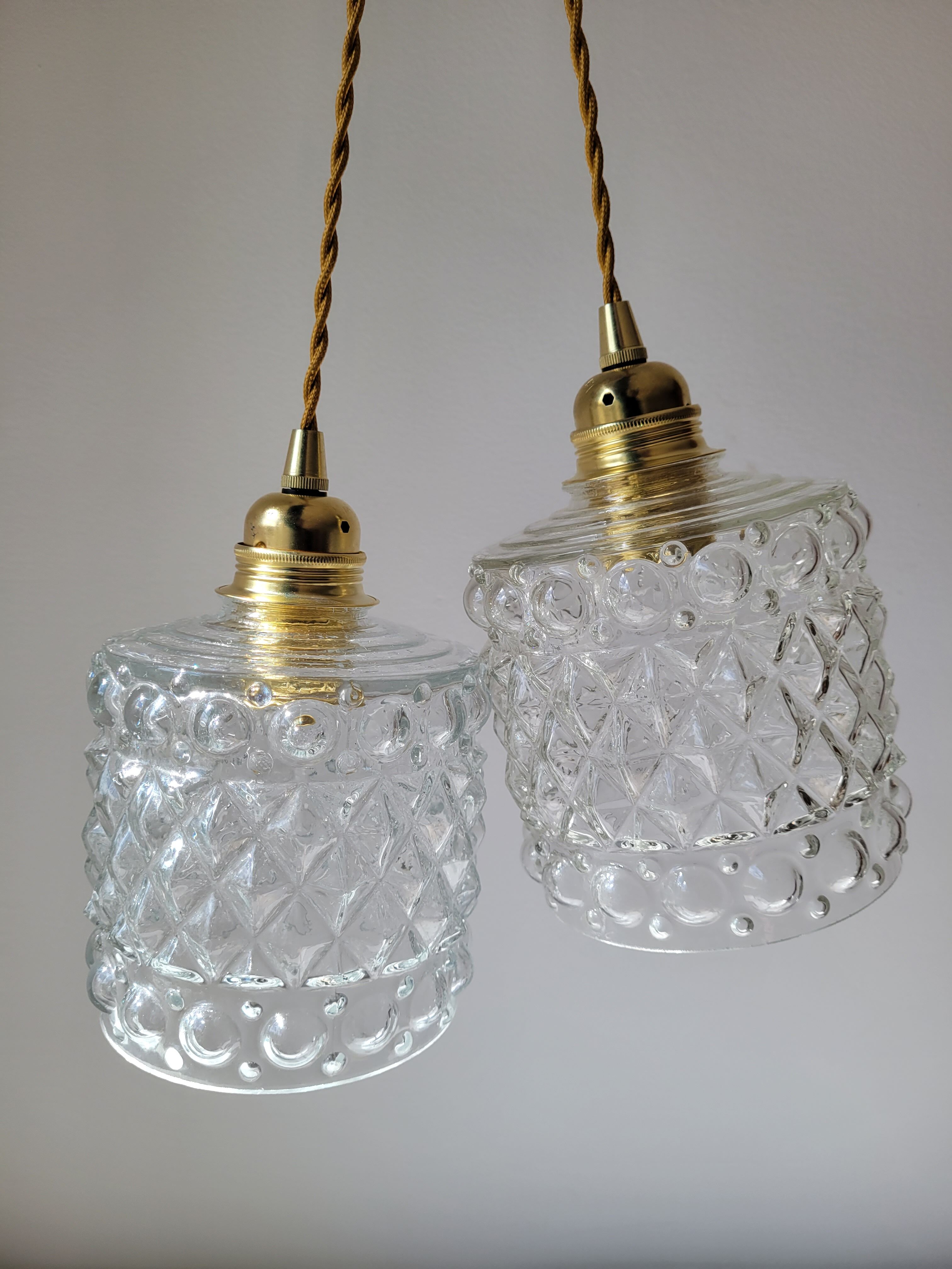 Duo of molded glass pendant lights