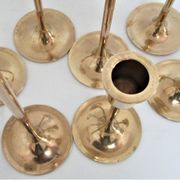Series of seven candle holders solid brass
