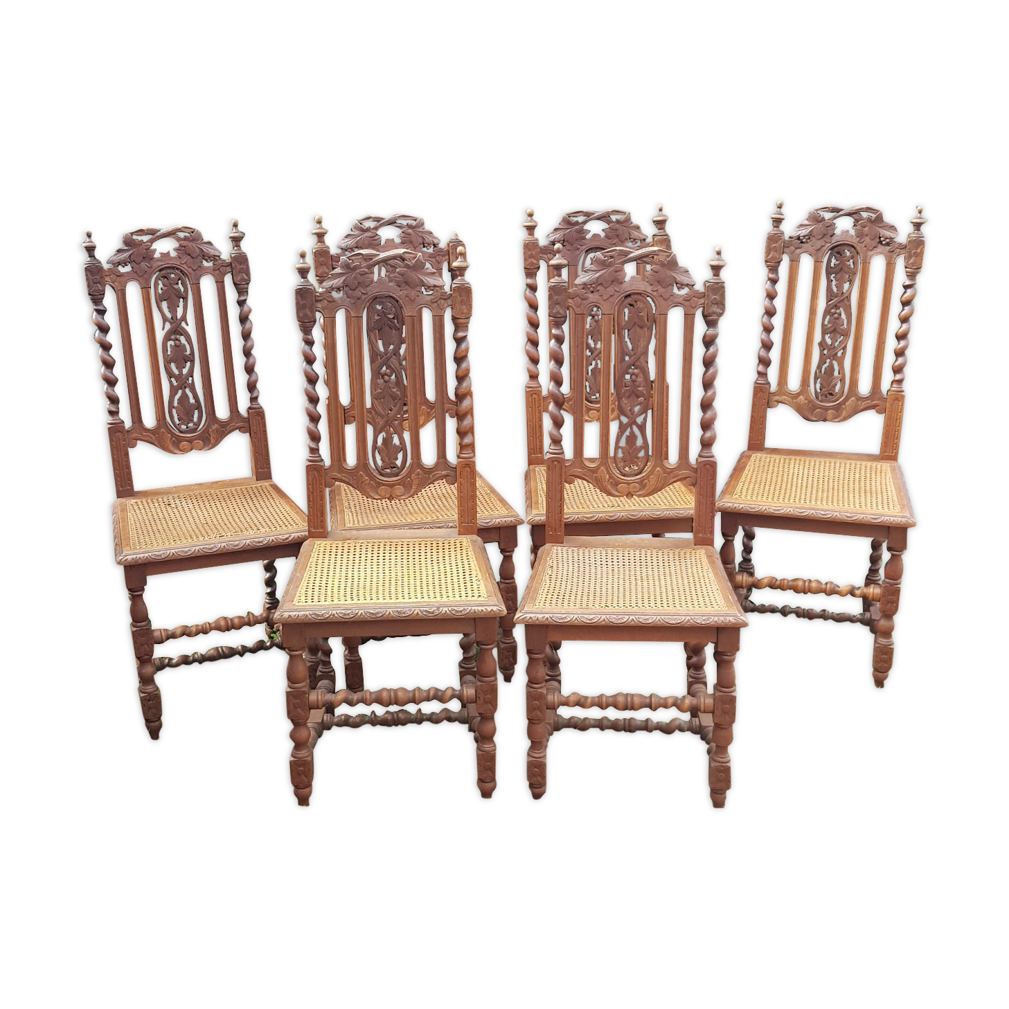 Carved antique chairs with rattan seat
