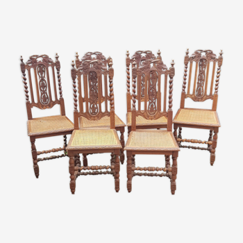 Carved antique chairs with rattan seat