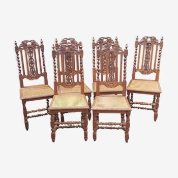 Chaises anciennes sculptées avec assis en rotin