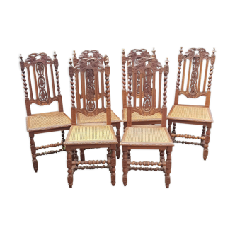 Carved antique chairs with rattan seat