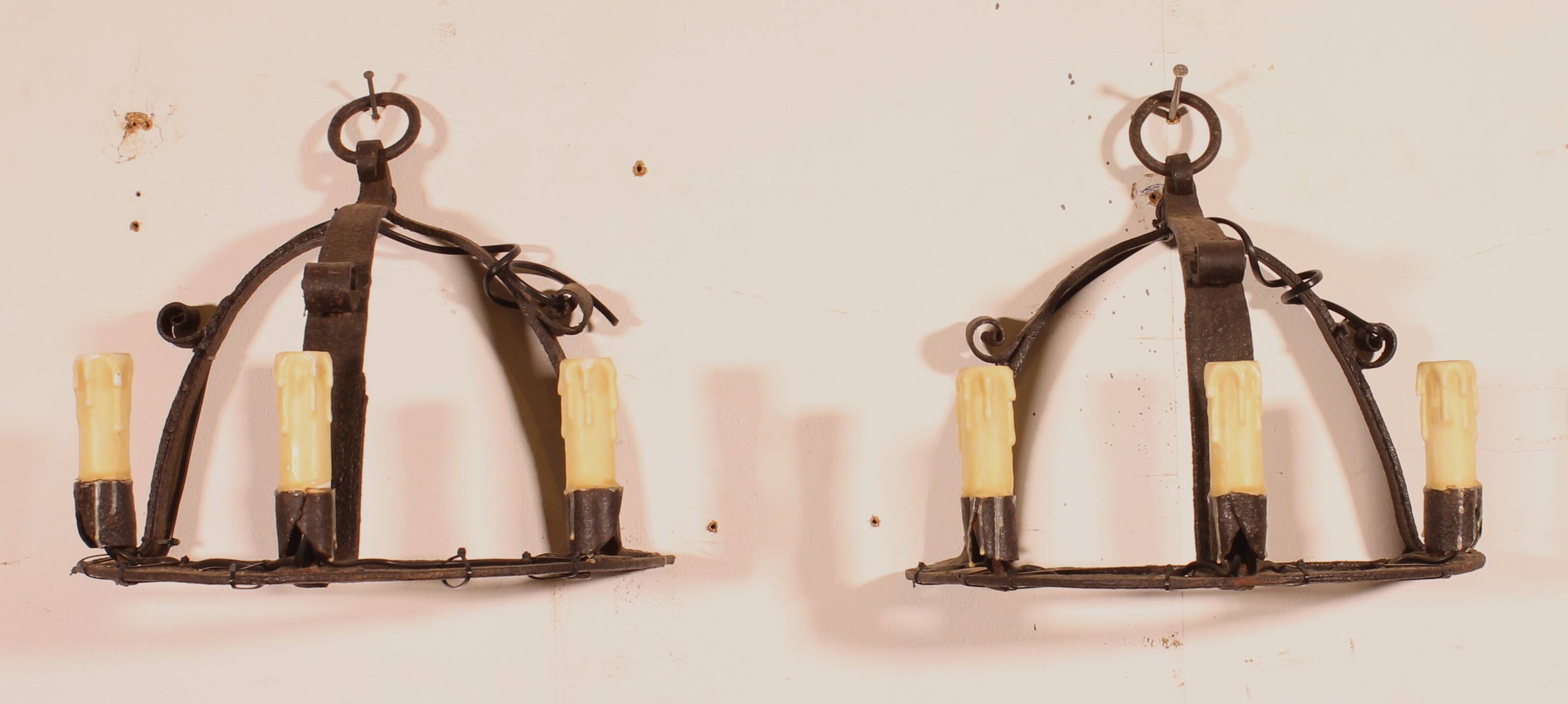 Pair of wrought iron wall sconces in medieval style